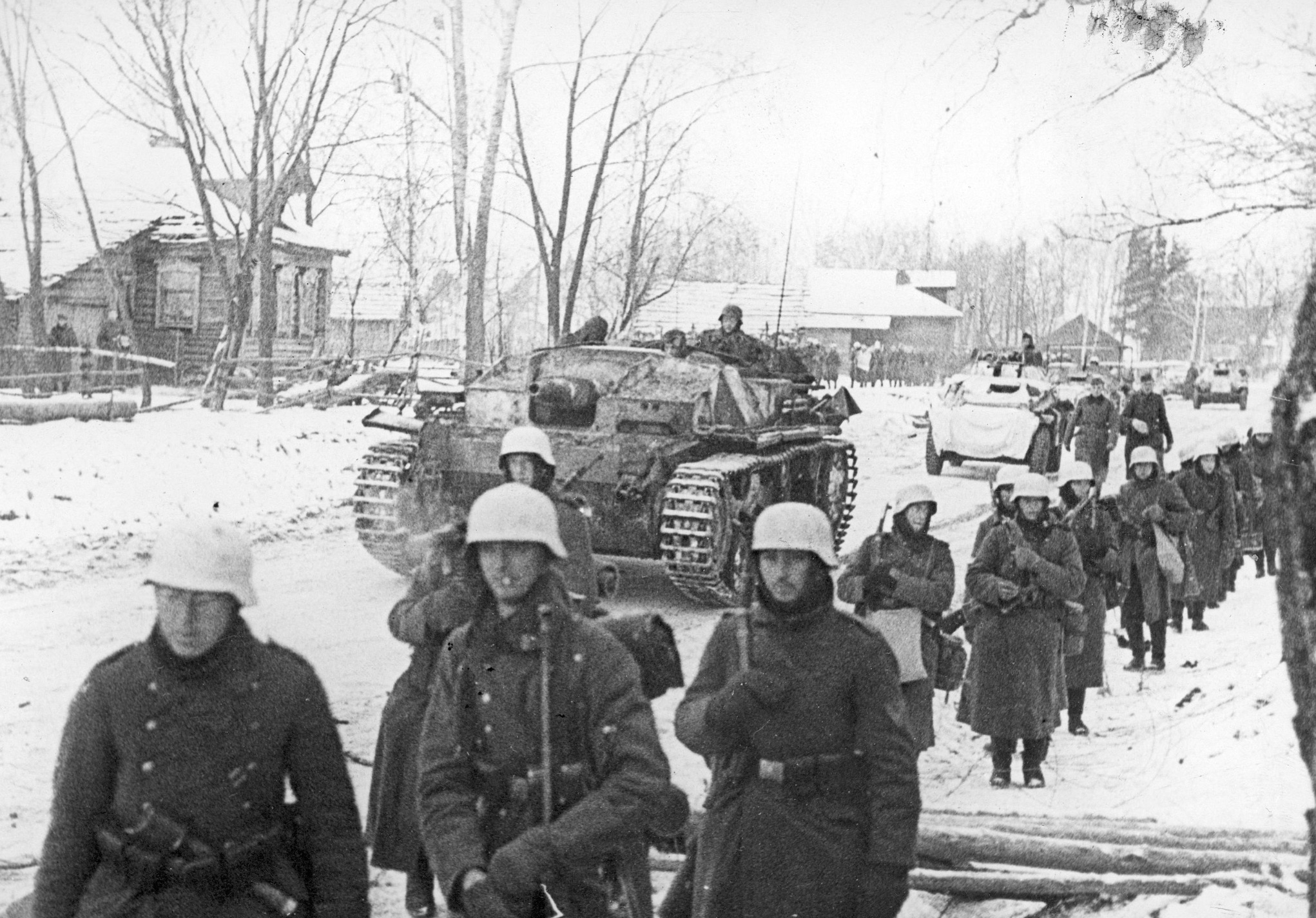 German mechanized forces move through a hamlet towards Moscow. 